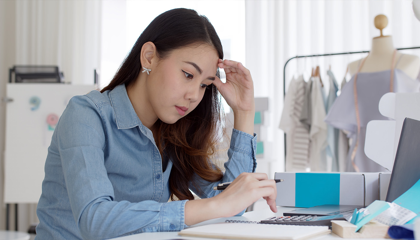 Young woman focused on work in a modern workspace, illustrating tax deduction concepts for C&D Advisory.